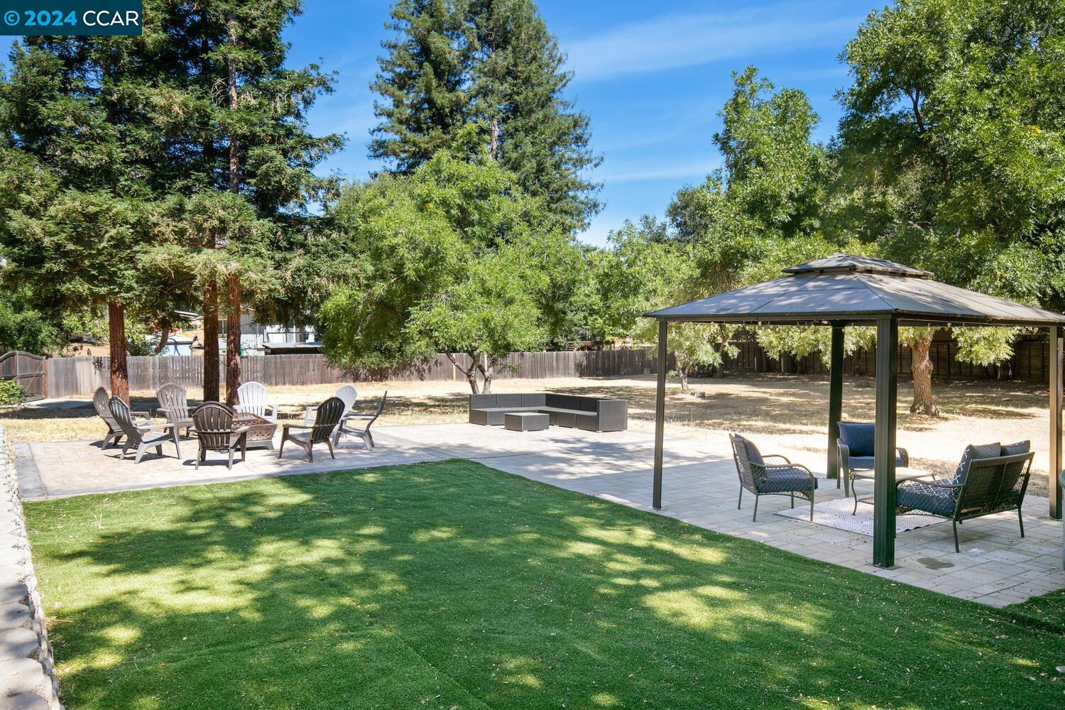 4775 Morgan Territory Road Clayton, CA 94517 - Photo 1 of 1 a view of a backyard with a sitting area and slide