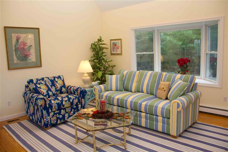 17 Preakness Lane Mashpee, MA 02649 - Photo 12 of 34 a living room with furniture and a large window