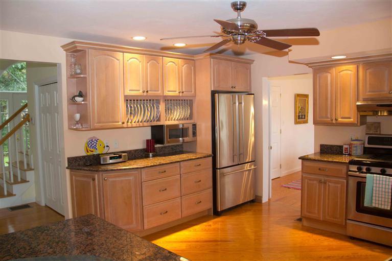17 Preakness Lane Mashpee, MA 02649 - Photo 7 of 34 a kitchen with granite countertop a refrigerator and a sink