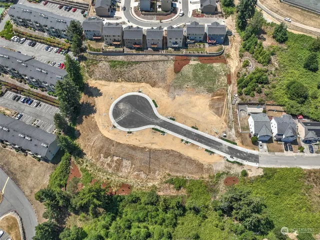 an aerial view of a house with yard swimming pool and outdoor seating