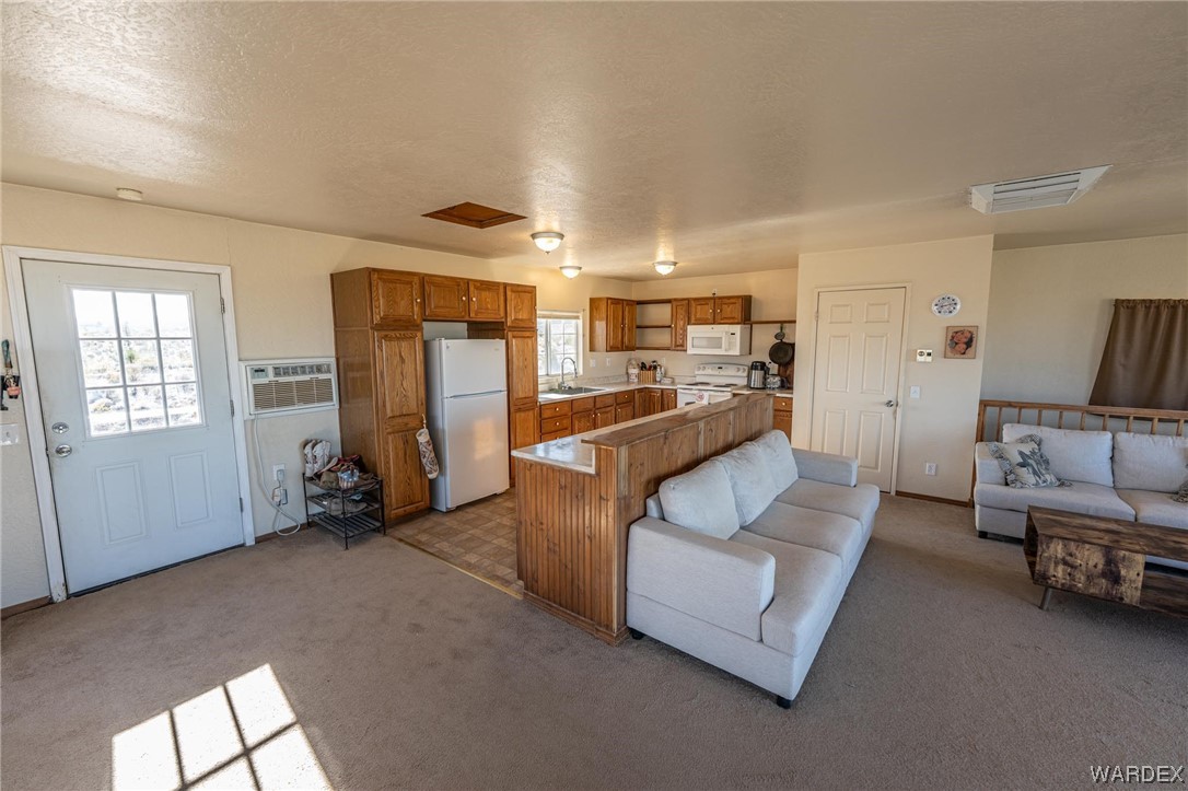 180 Sunfish Way Meadview, AZ 86444 - Photo 12 of 42 a living room with furniture and a walk in closet