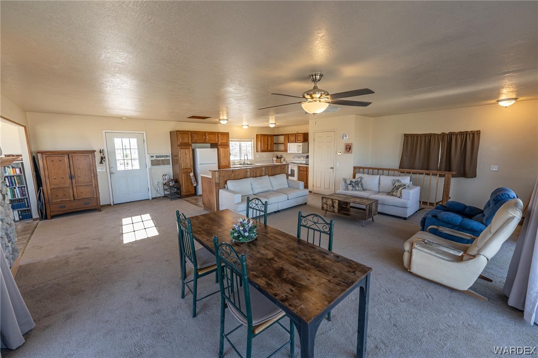 180 Sunfish Way Meadview, AZ 86444 - Photo 18 of 42 a living room with furniture and a ceiling fan