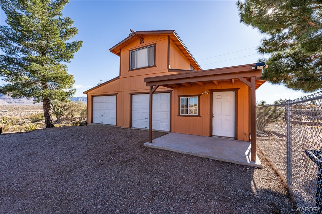 180 Sunfish Way Meadview, AZ 86444 - Photo 2 of 42 a front view of a house with a yard