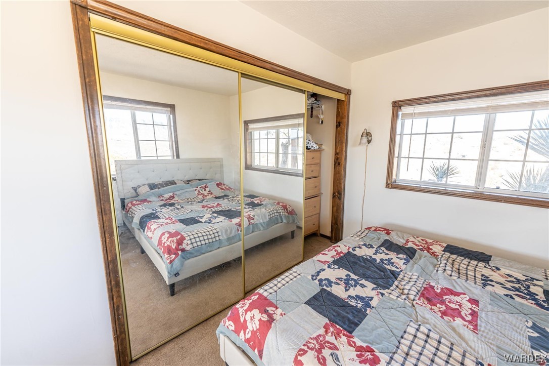 180 Sunfish Way Meadview, AZ 86444 - Photo 21 of 42 a bedroom with bed and a window