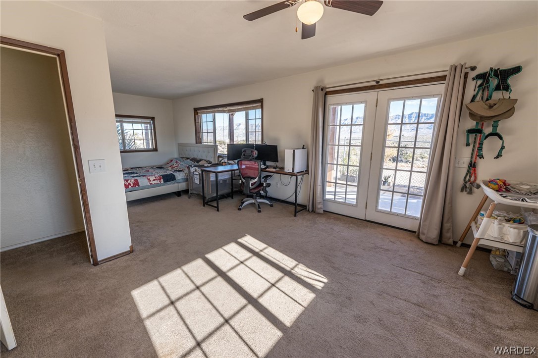 180 Sunfish Way Meadview, AZ 86444 - Photo 22 of 42 a living room with furniture and a window