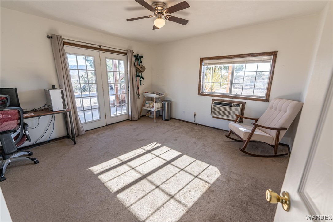 180 Sunfish Way Meadview, AZ 86444 - Photo 23 of 42 a living room with furniture and a window
