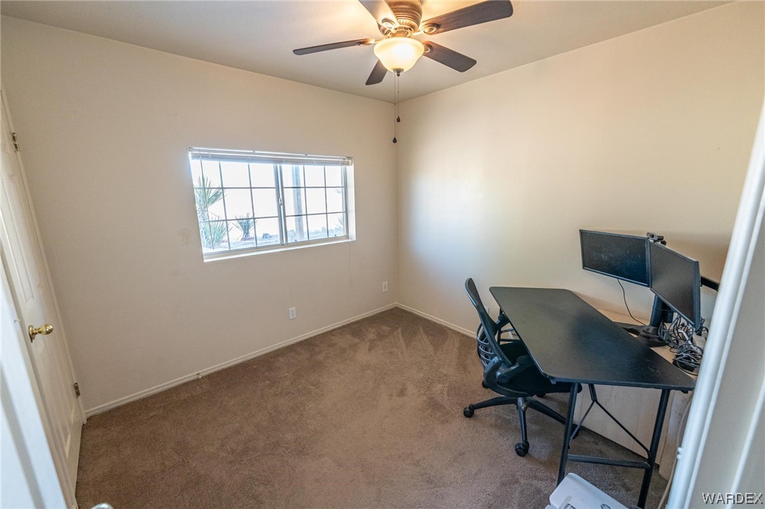180 Sunfish Way Meadview, AZ 86444 - Photo 25 of 42 a workspace with furniture and a window