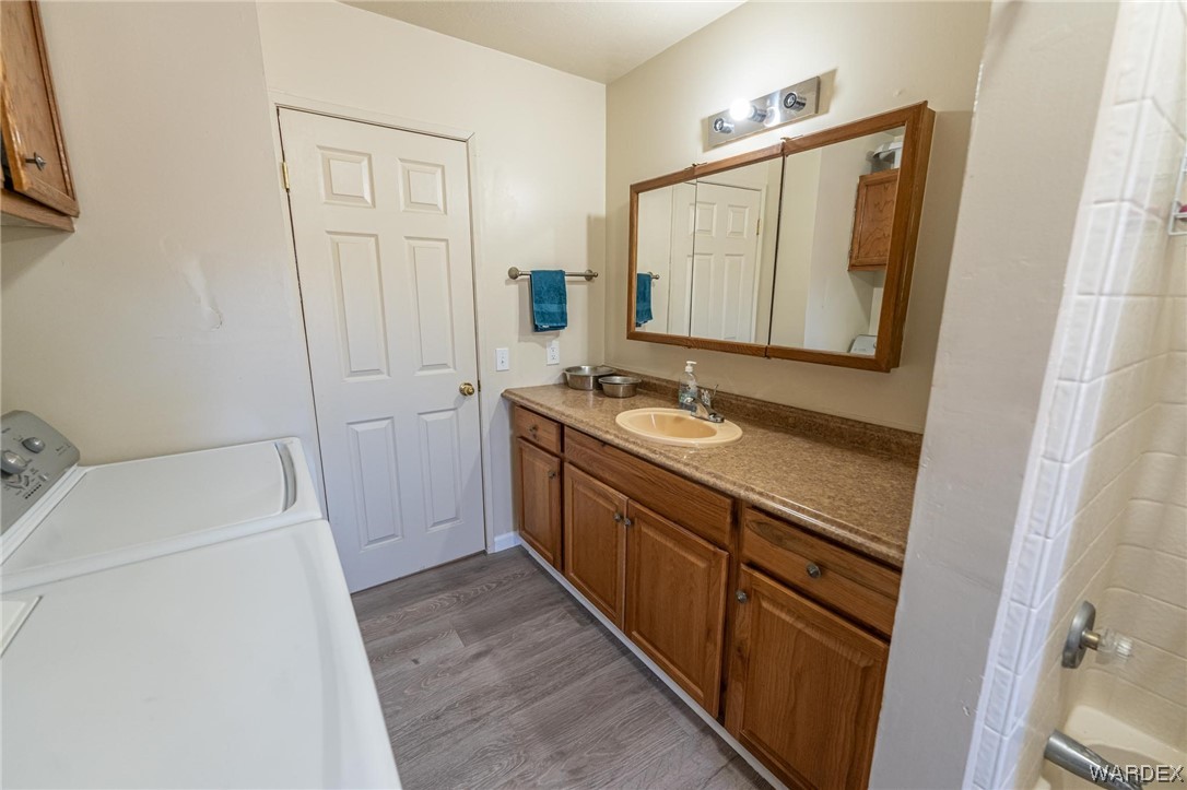 180 Sunfish Way Meadview, AZ 86444 - Photo 26 of 42 a bathroom with a sink a toilet and a mirror