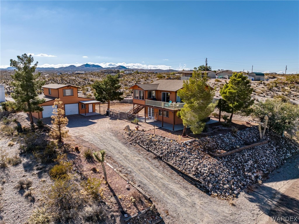 180 Sunfish Way Meadview, AZ 86444 - Photo 41 of 42 a view of a houses with a yard and a large tree