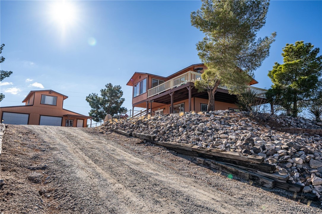 180 Sunfish Way Meadview, AZ 86444 - Photo 42 of 42 a front view of a house with a yard street and trees
