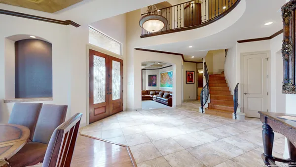 a view of a livingroom with furniture and staircase