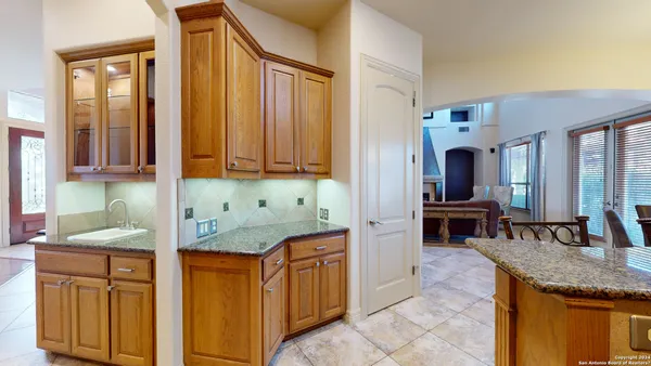 a kitchen with stainless steel appliances granite countertop a sink and cabinets