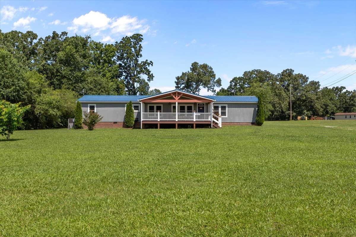 1112 Garners Creek Road Dickson, TN 37055 - Photo 35 of 57 a front view of house with yard and trees in the background