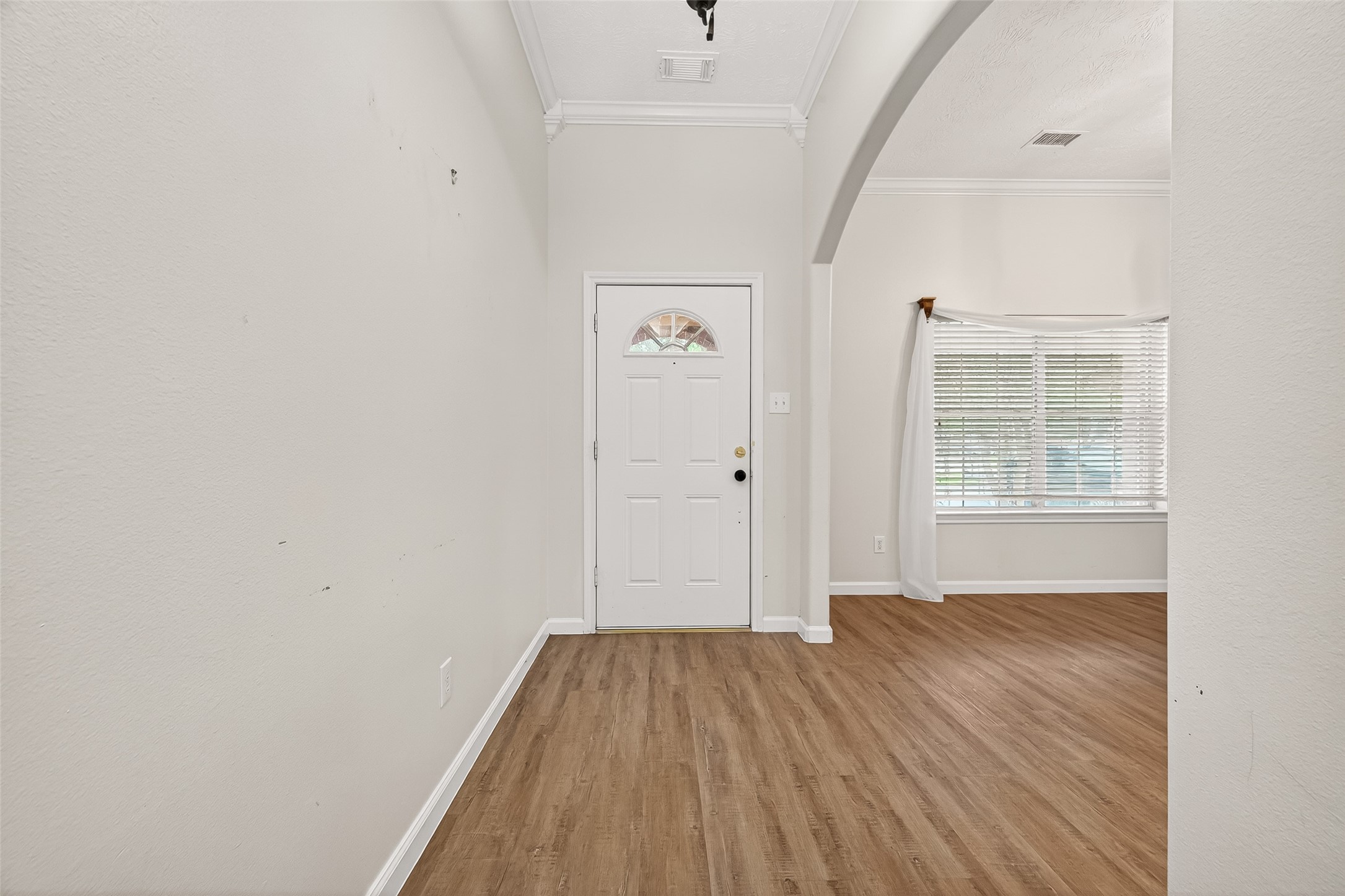 5517 Autumn Ash Lane Rosharon, TX 77583 - Photo 5 of 50 a view of a room with wooden floor and windows