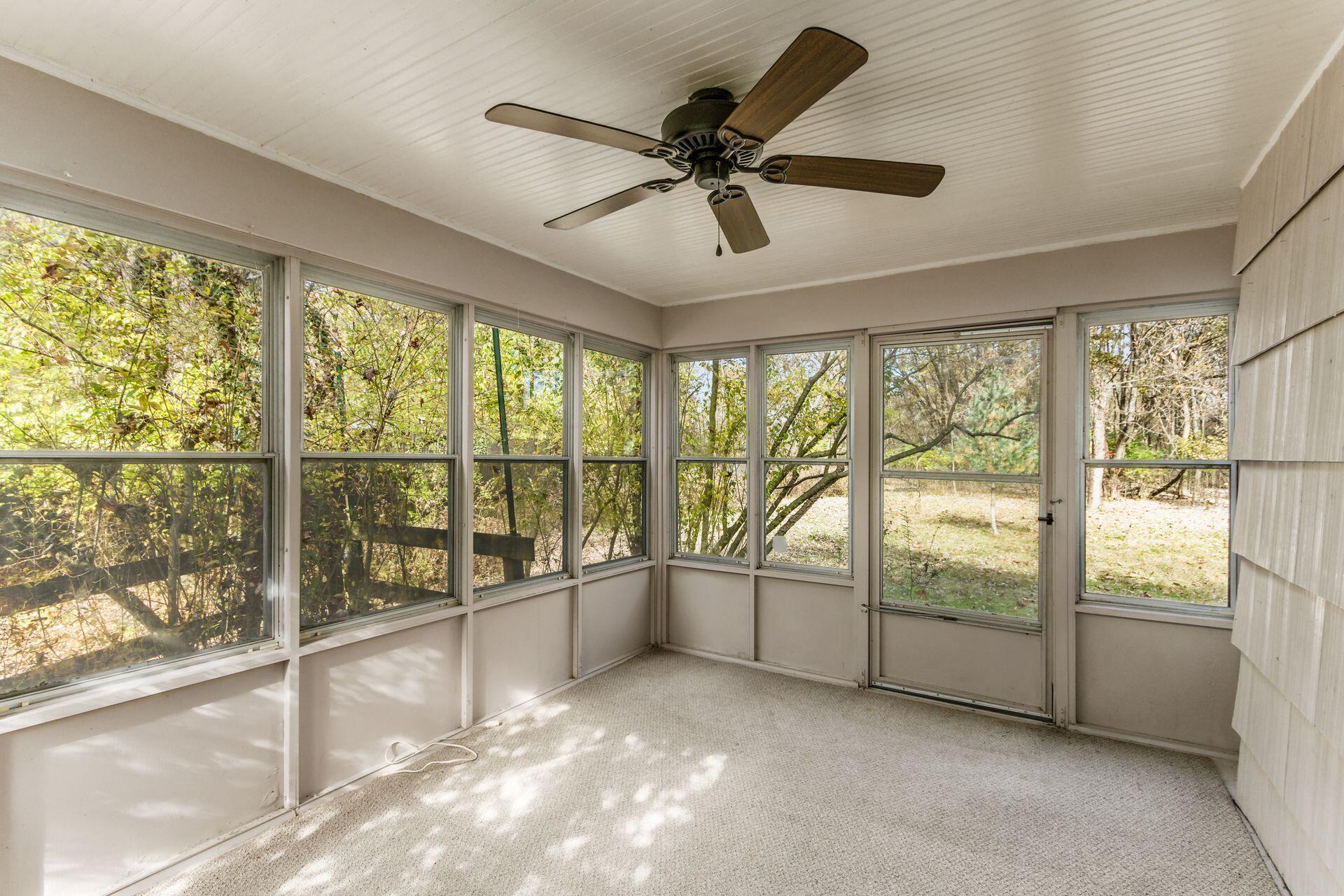2620 Drake Road Columbus, OH 43219 - Photo 11 of 20 Carpeted screen porch with ceiling fan and beaded wood ceiling