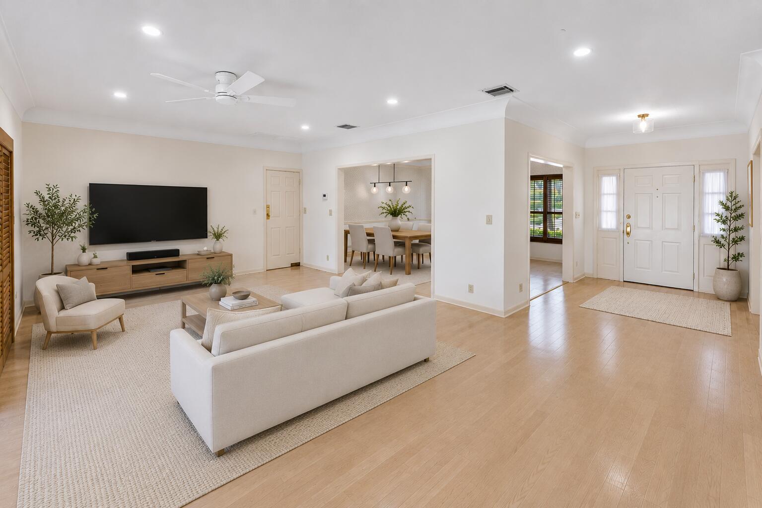 1851 Thatch Palm Drive Boca Raton, FL 33432 - Photo 10 of 70 a living room with furniture and a flat screen tv