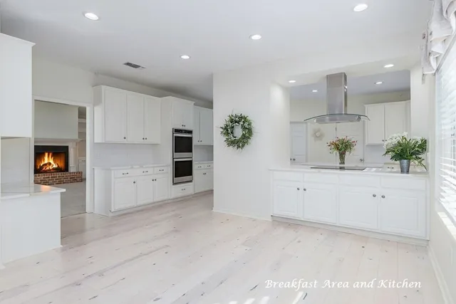a view of a kitchen with wooden floor