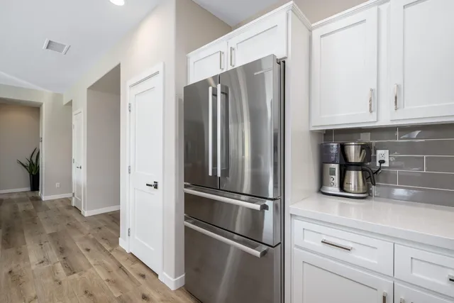 a bathroom with a shower sink and mirror