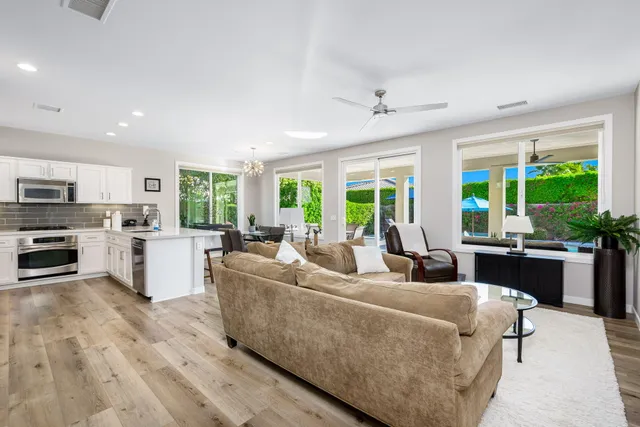 a kitchen with a stove a sink and a refrigerator