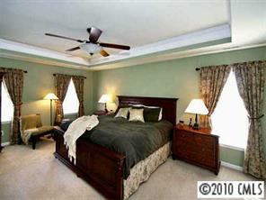 4726 Lapis Court Fort Mill, SC 29708 - Photo 5 of 8 a bedroom with a bed and a large window
