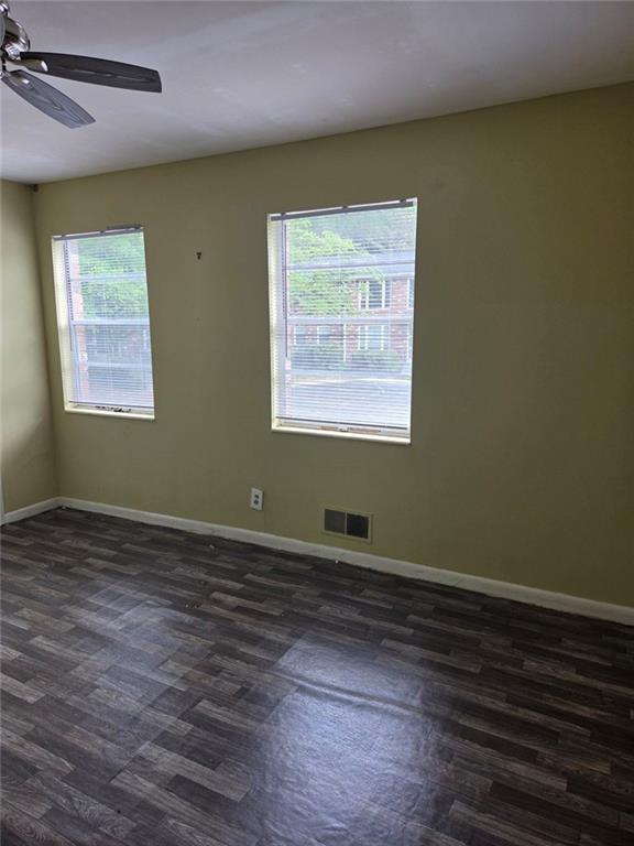 510 Coventry Road, Unit 3A Decatur, GA 30030 - Photo 15 of 24 a view of an empty room with wooden floor and a window