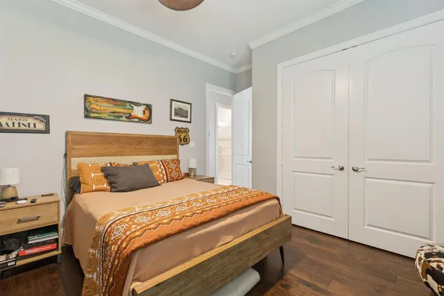 a bedroom with a bed and a view of bathroom