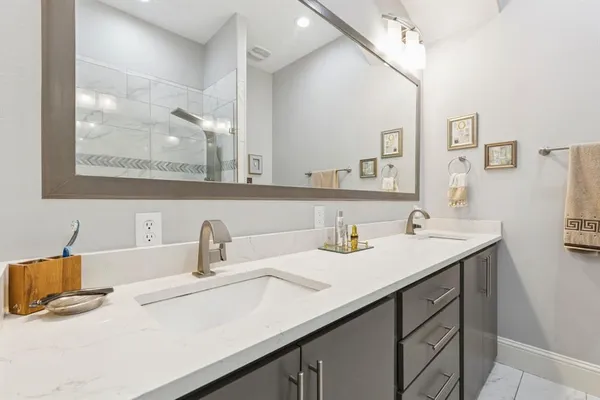 a bathroom with a sink and a mirror