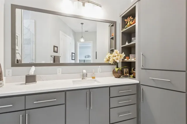 a bathroom with a sink and a mirror