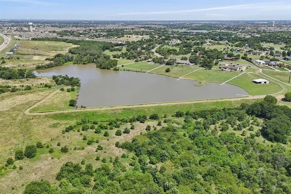 a view of a lake with a yard