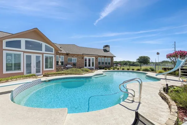 a view of a swimming pool with a garden