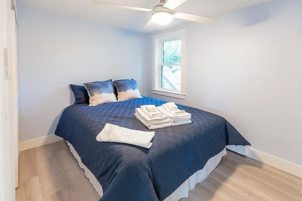 a bedroom with a bed and window
