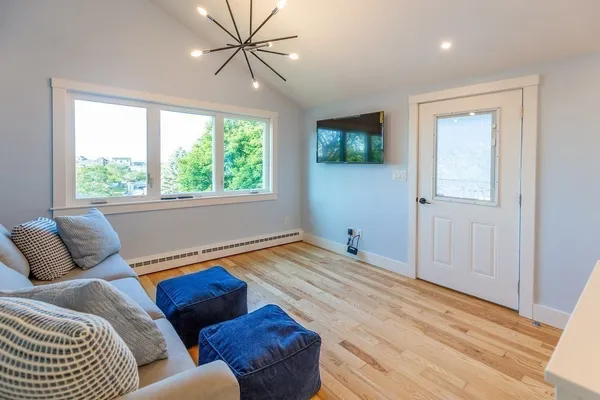 a living room with a couch and a window