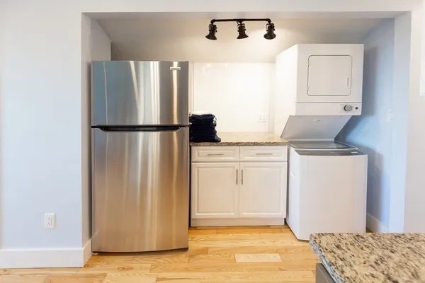 a refrigerator freezer sitting inside of a kitchen