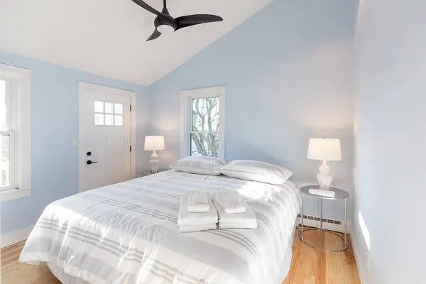 a bedroom with a bed and a window