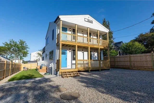 a view of a backyard with a sitting area and slide