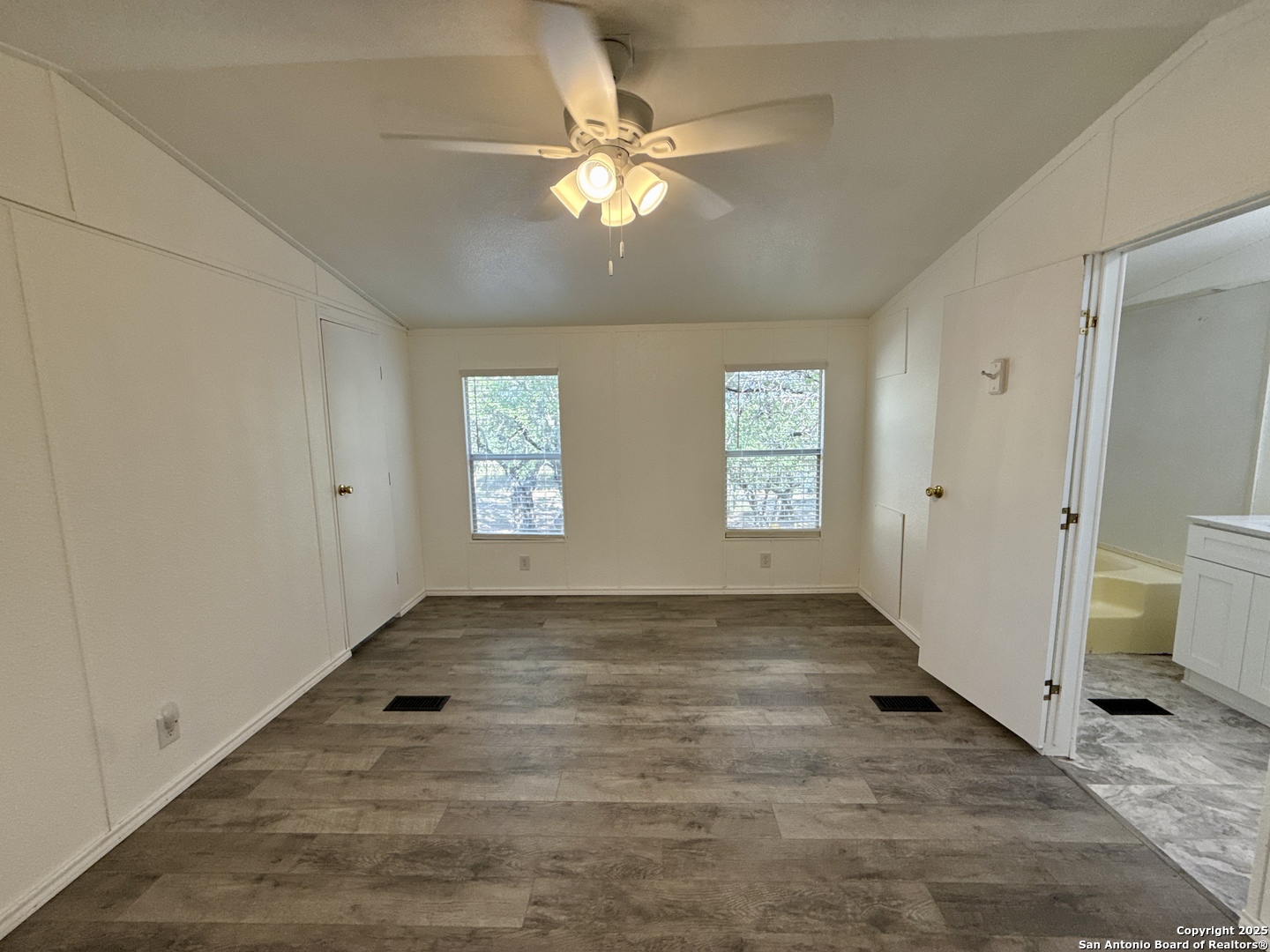 300 Pecos Road Bandera, TX 78003 - Photo 12 of 44 an empty room with closet and windows