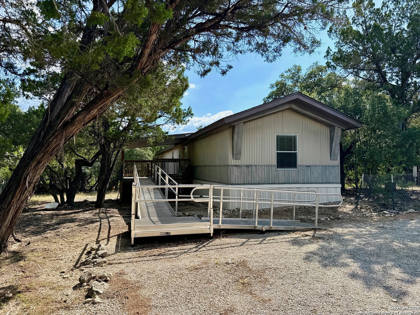 300 Pecos Road Bandera, TX 78003 - Photo 2 of 44 a view of a house with a yard