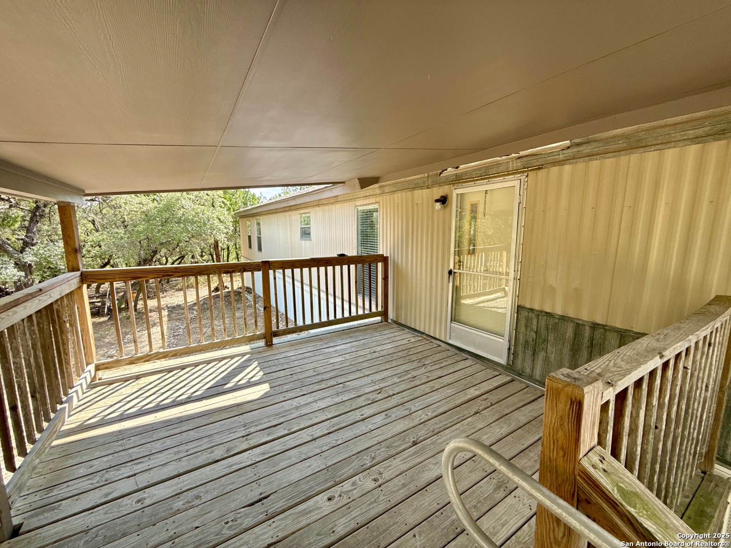 300 Pecos Road Bandera, TX 78003 - Photo 23 of 44 a view of a balcony with wooden floor
