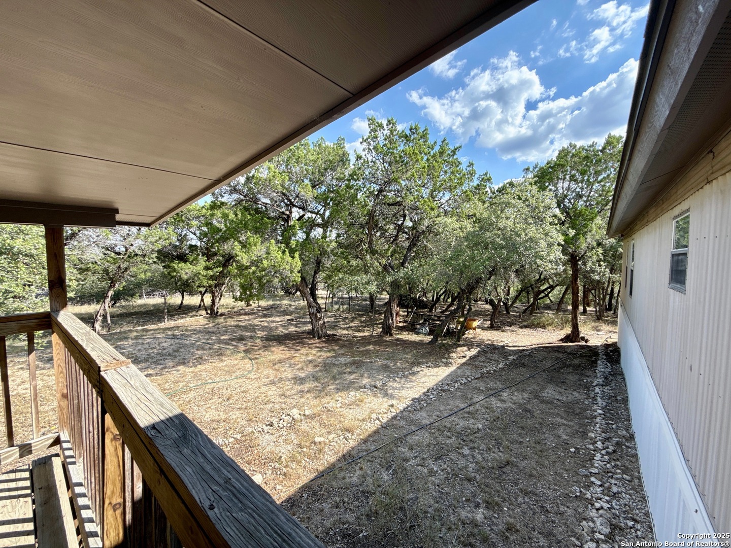300 Pecos Road Bandera, TX 78003 - Photo 25 of 44 a view of a backyard with wooden fence
