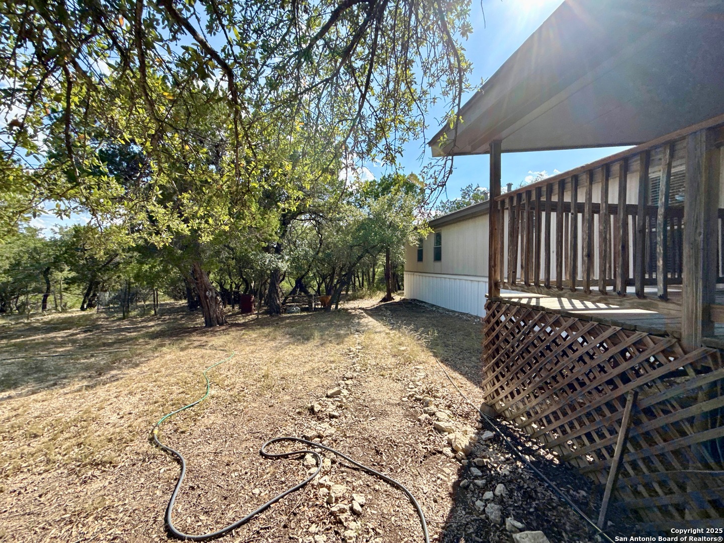 300 Pecos Road Bandera, TX 78003 - Photo 26 of 44 a view of a backyard with a small cabin