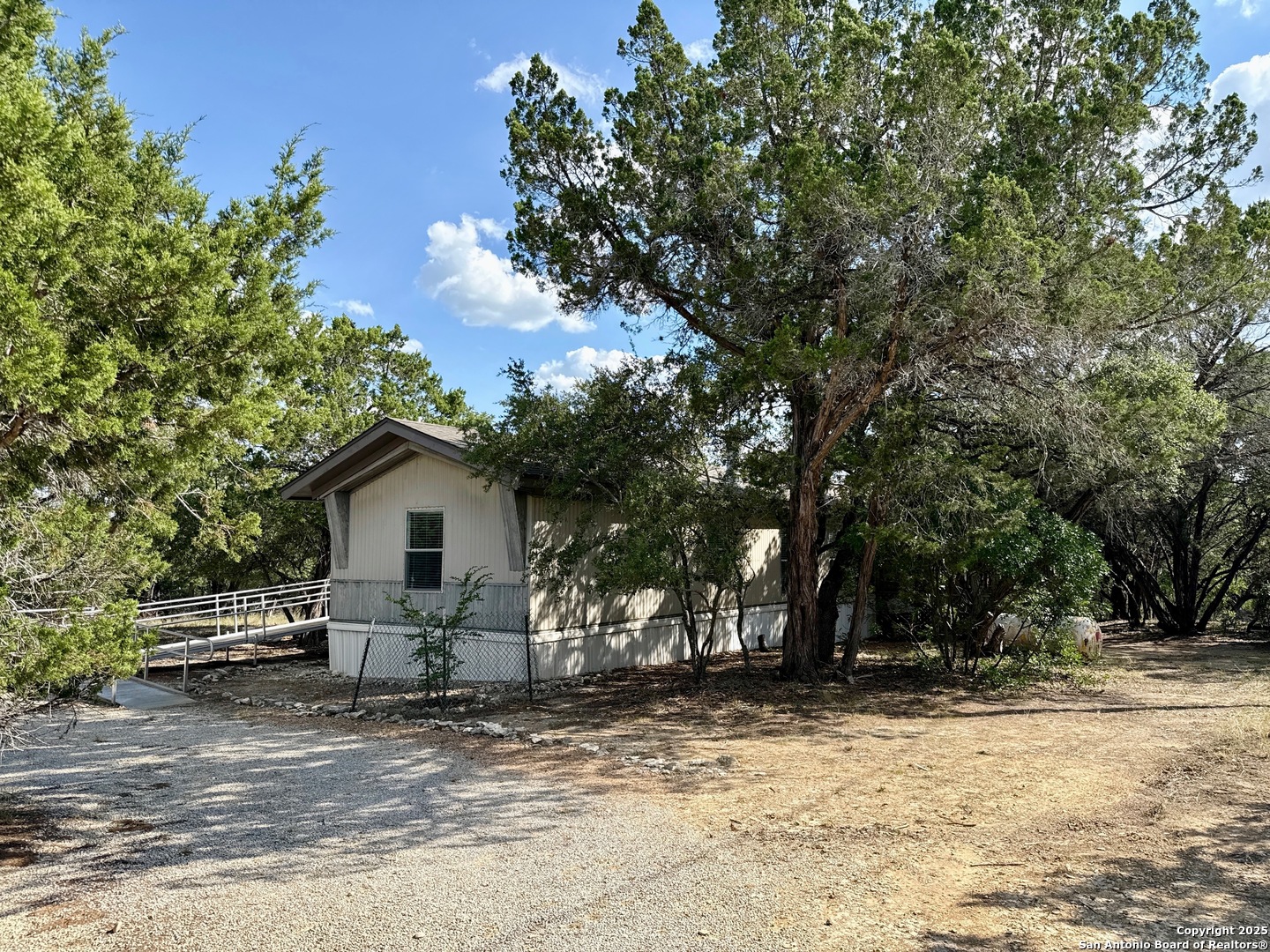 300 Pecos Road Bandera, TX 78003 - Photo 29 of 44 a view of a house with a yard