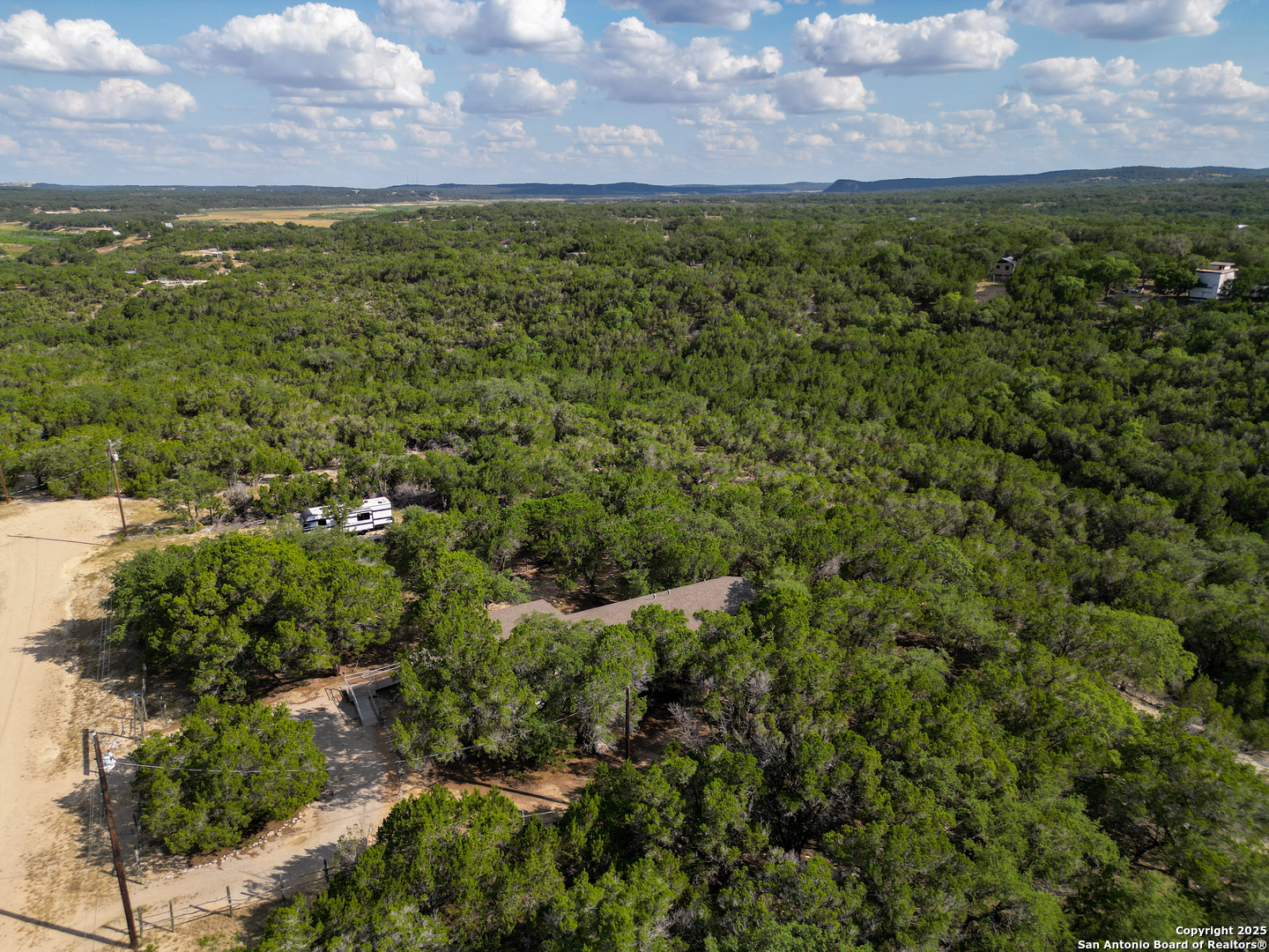 300 Pecos Road Bandera, TX 78003 - Photo 31 of 44 a view of a yard with an trees
