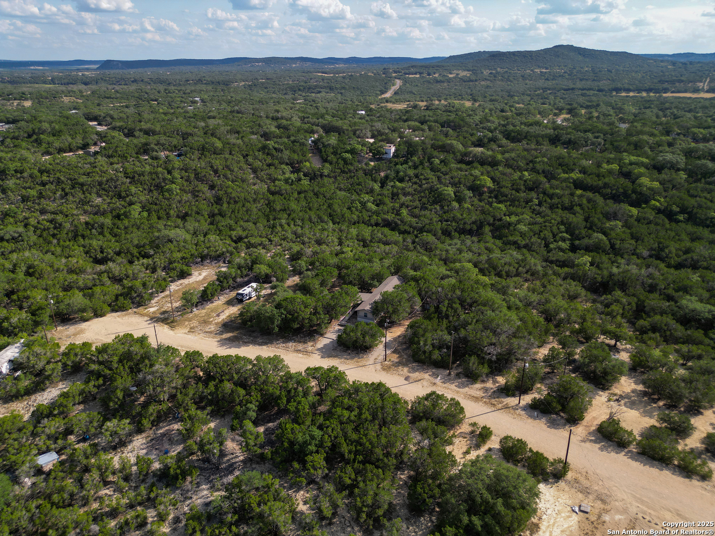 300 Pecos Road Bandera, TX 78003 - Photo 37 of 44 an aerial view of residential house with green space