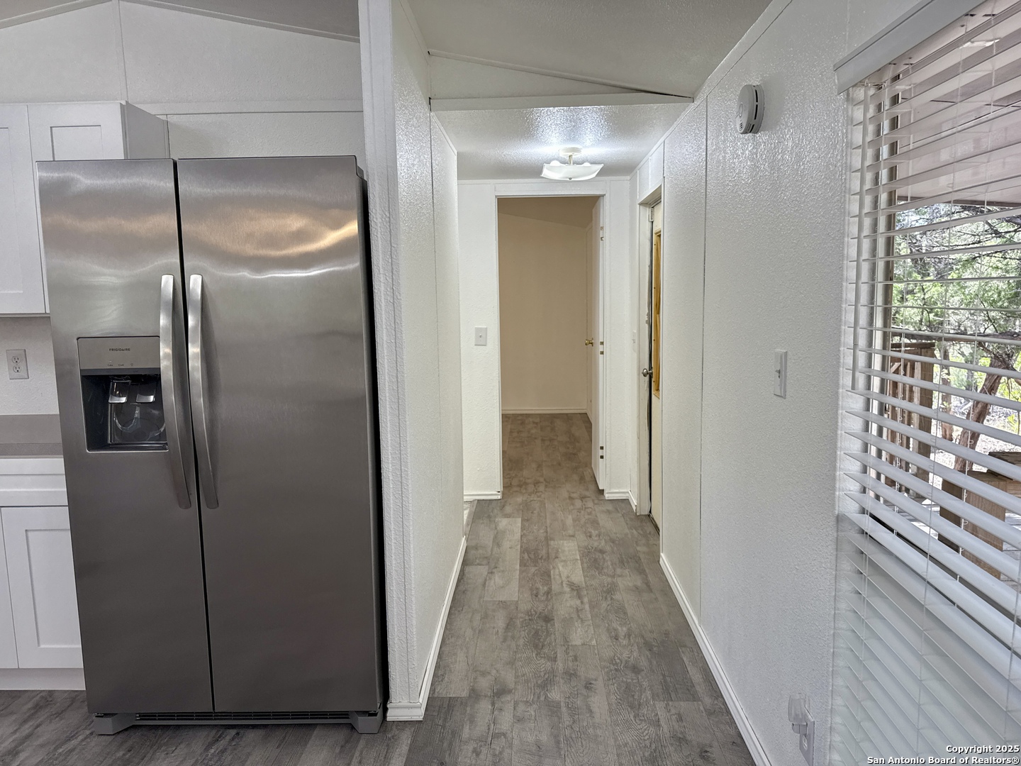 300 Pecos Road Bandera, TX 78003 - Photo 10 of 44 a view of a room with wooden floor