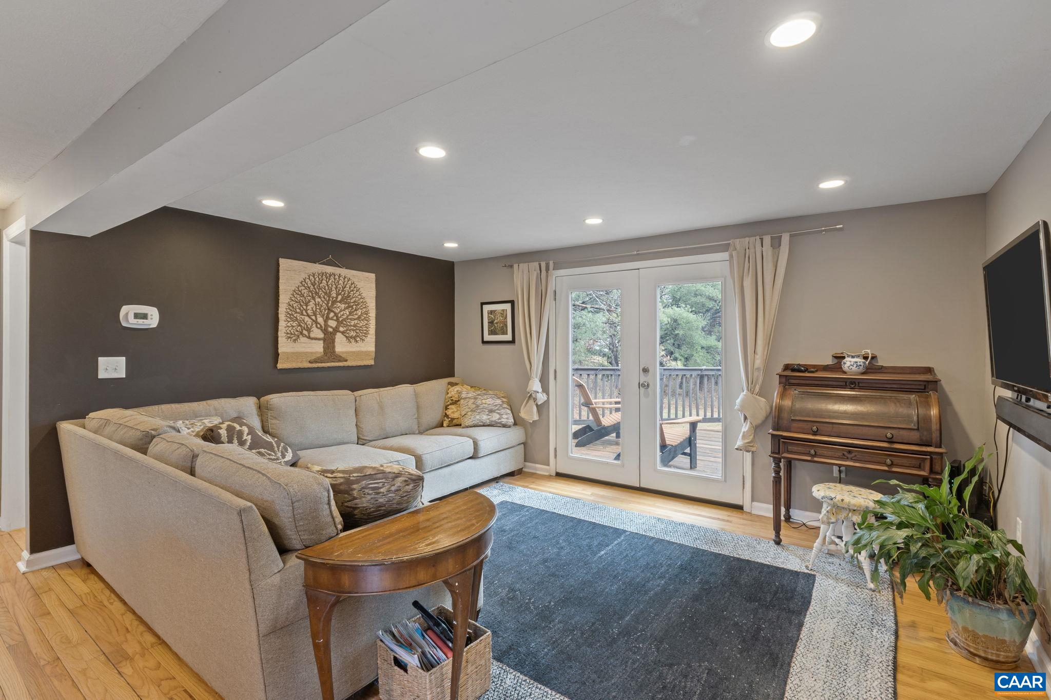 504 Newtown Road Greenwood, VA 22943 - Photo 11 of 34 a living room with furniture and a flat screen tv