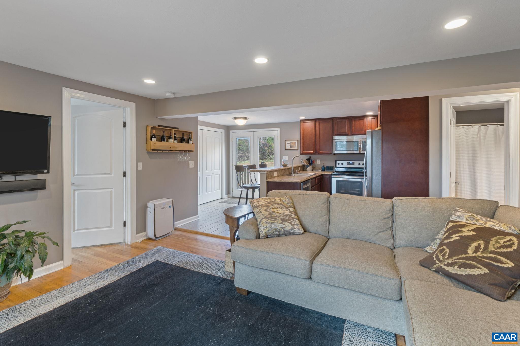 504 Newtown Road Greenwood, VA 22943 - Photo 12 of 34 a living room with furniture and a flat screen tv