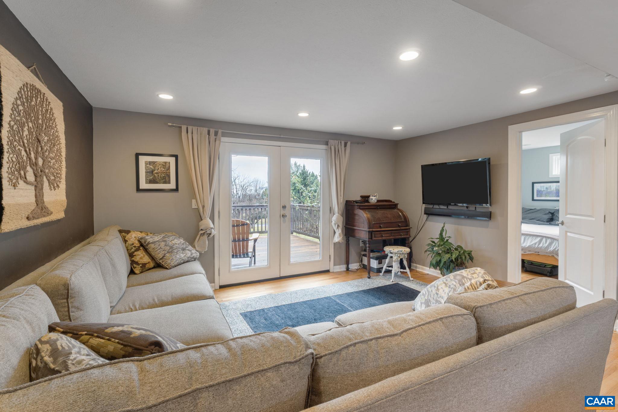 504 Newtown Road Greenwood, VA 22943 - Photo 13 of 34 a living room with furniture and a flat screen tv