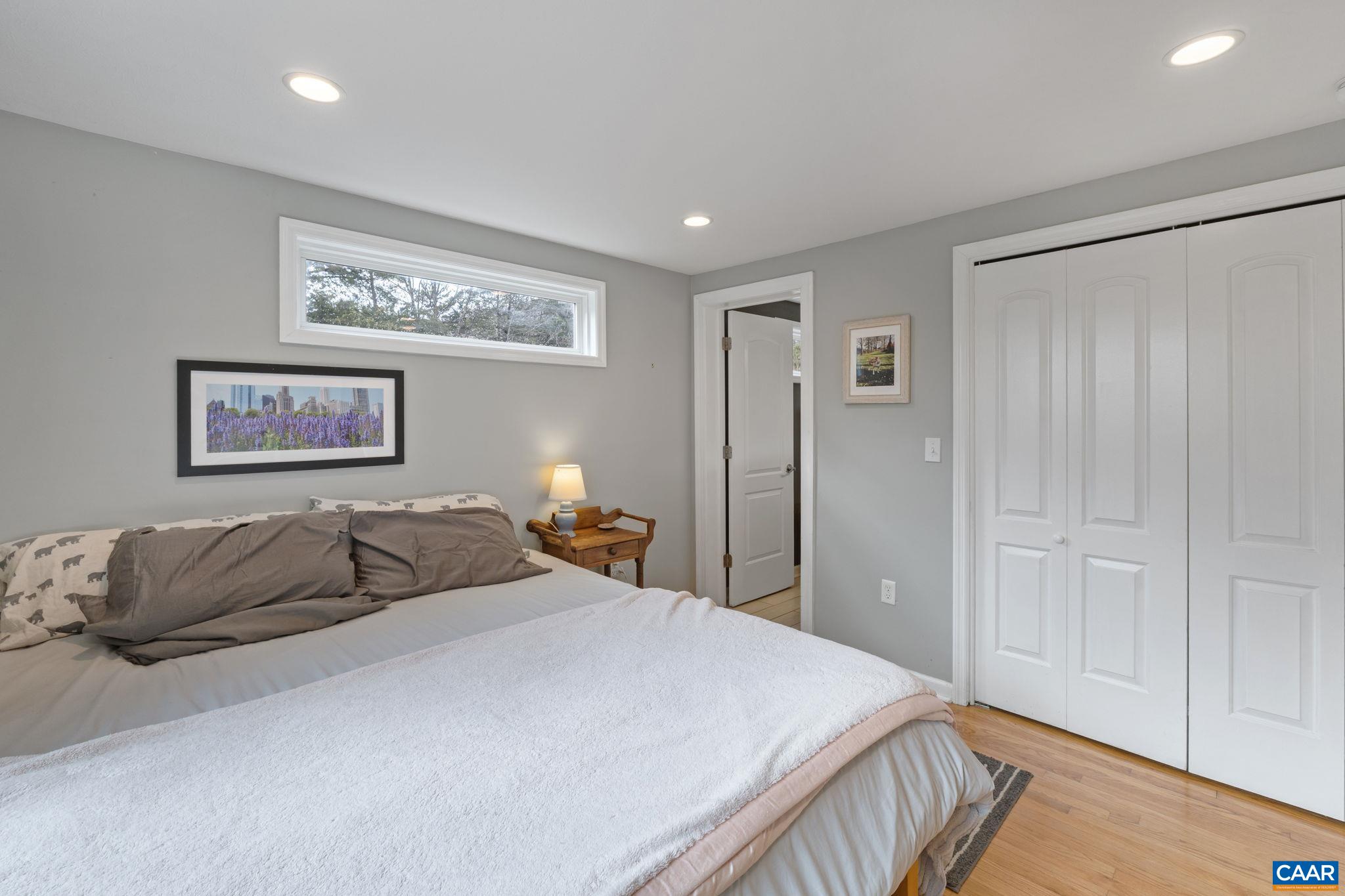 504 Newtown Road Greenwood, VA 22943 - Photo 16 of 34 a bedroom with a bed and a walk in closet