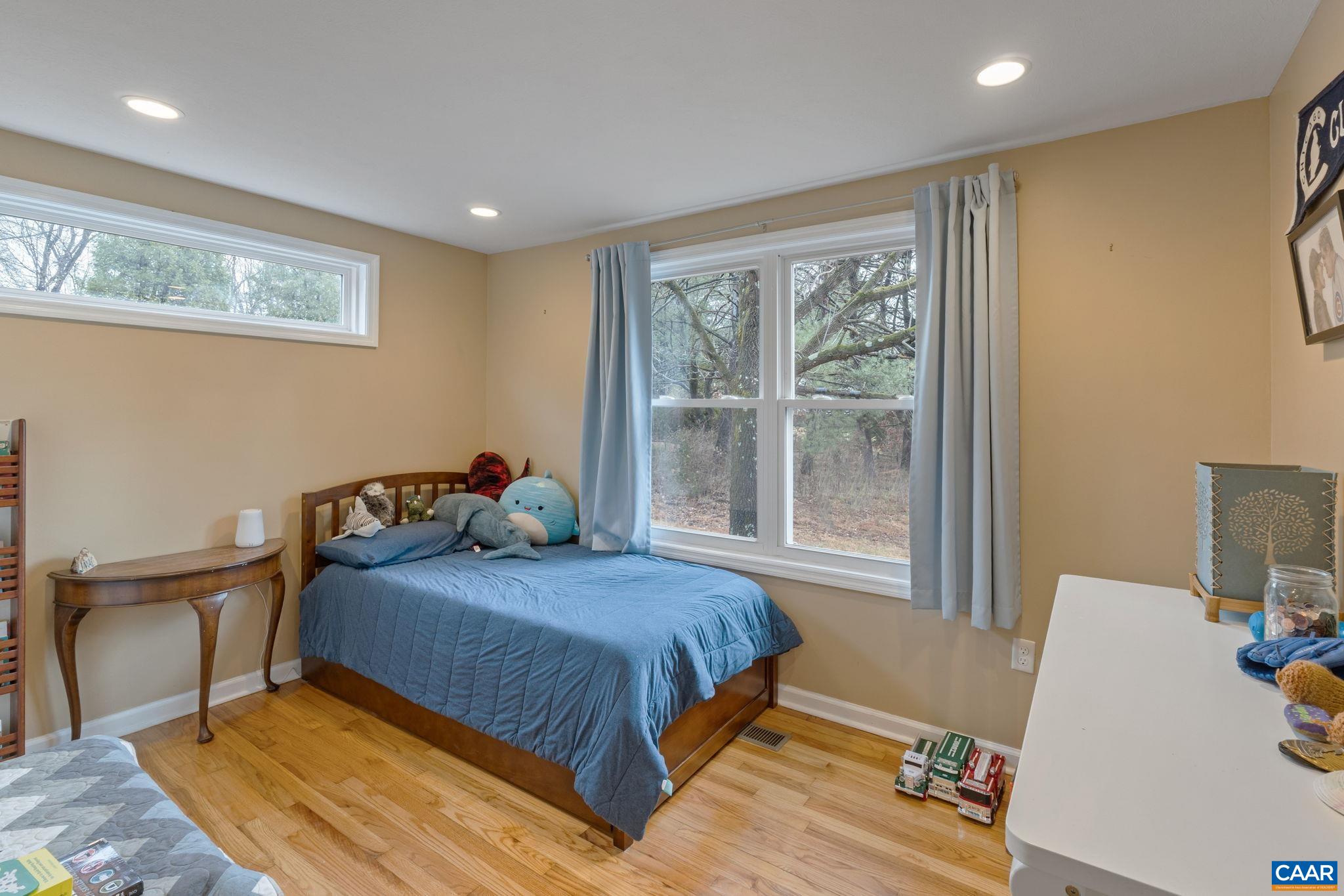 504 Newtown Road Greenwood, VA 22943 - Photo 18 of 34 a bedroom with a bed and wooden floor
