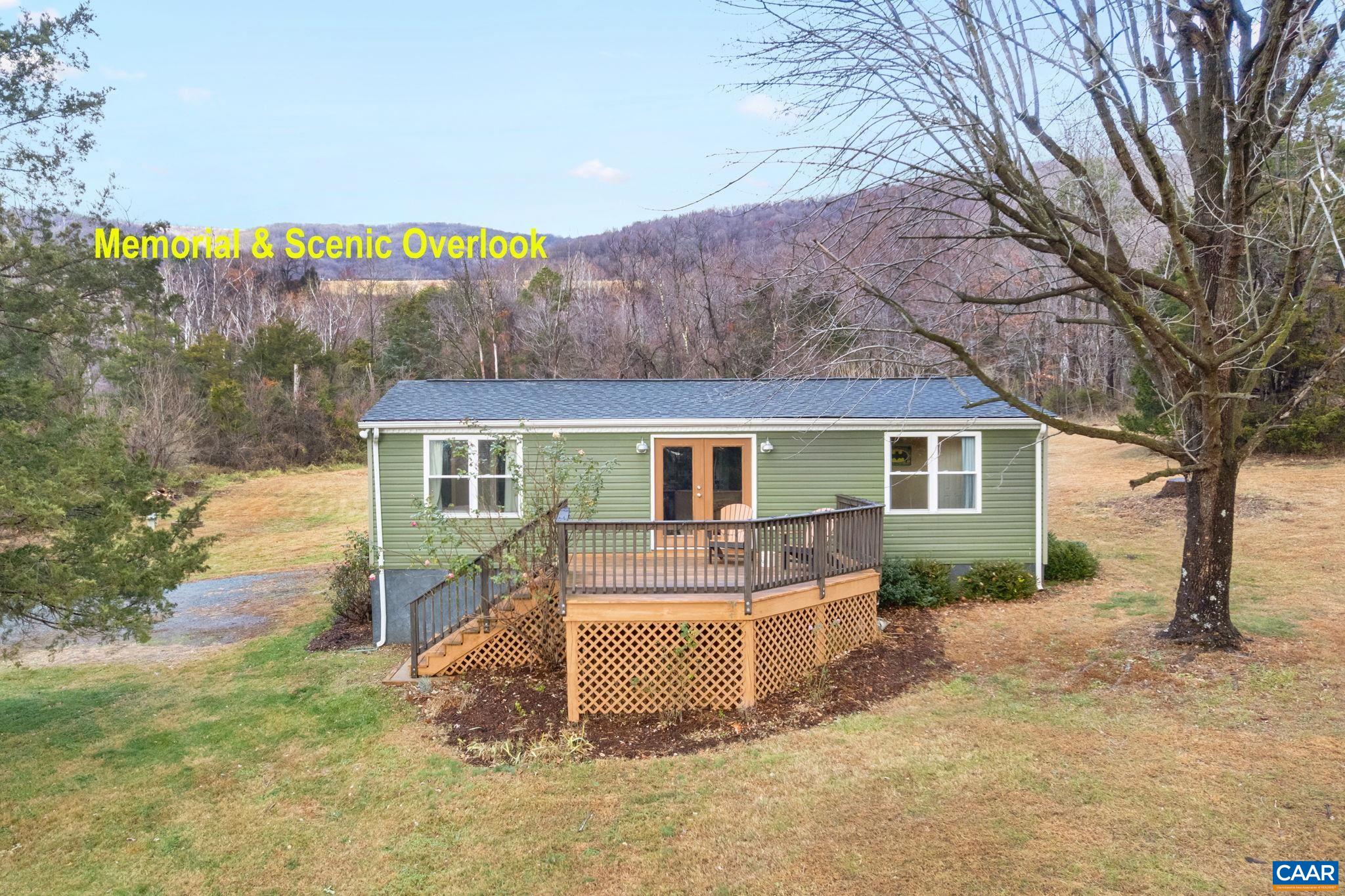 504 Newtown Road Greenwood, VA 22943 - Photo 2 of 34 a front view of a house with a yard and trees